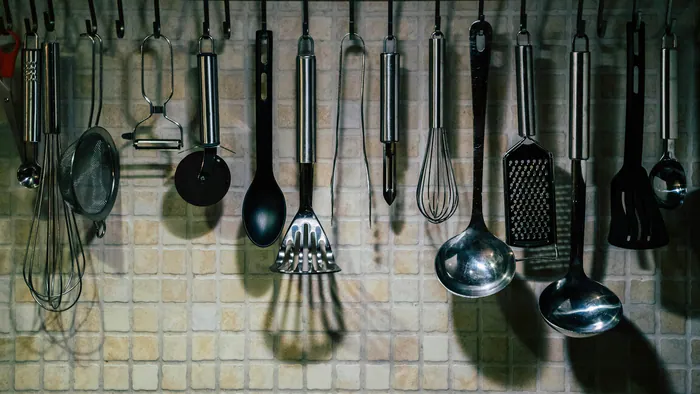 Kitchen utensils arranged on hooks